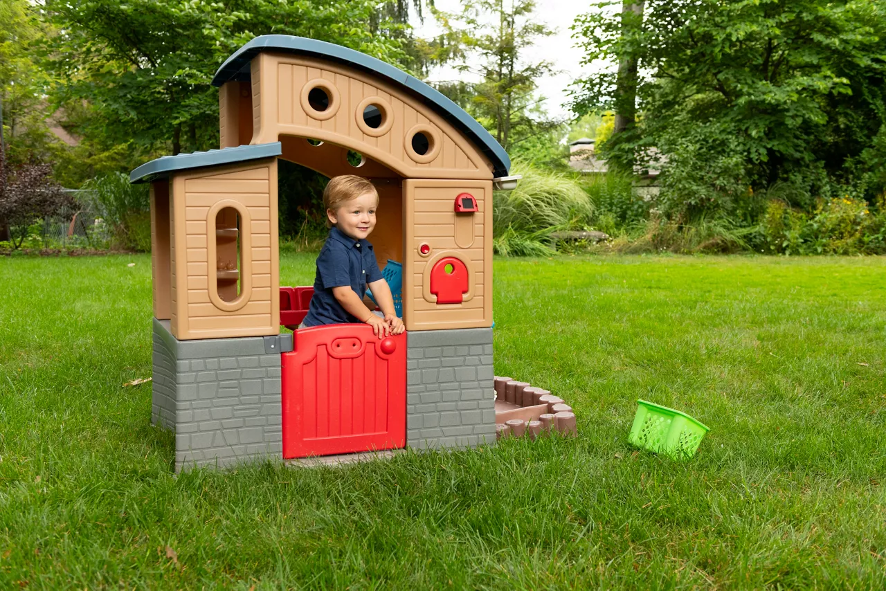 Child playing in rotational molded playset